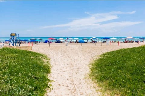 On the beach, sun loungers, beach towels