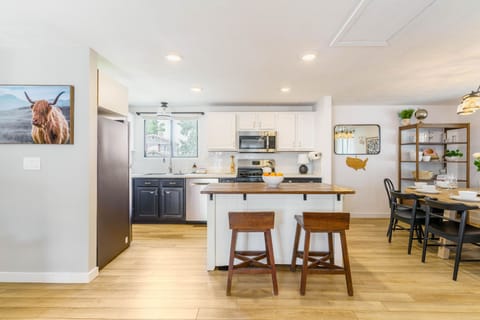 Kitchen table seats 6, with additional high counter stools for working or dining