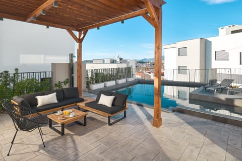 Outdoor pool, a heated pool, sun loungers