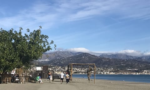 On the beach, sun loungers