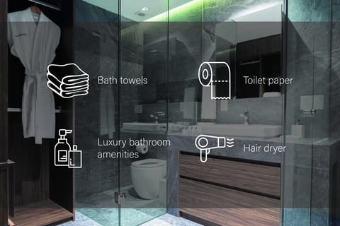 Bathtub, rainfall showerhead, hair dryer, towels