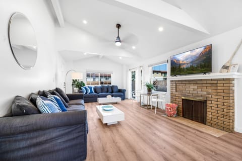 Spacious living room area with comfortable sofas and great natural lighting!