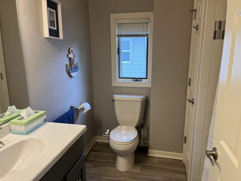 Upstairs bathroom with tub and shower