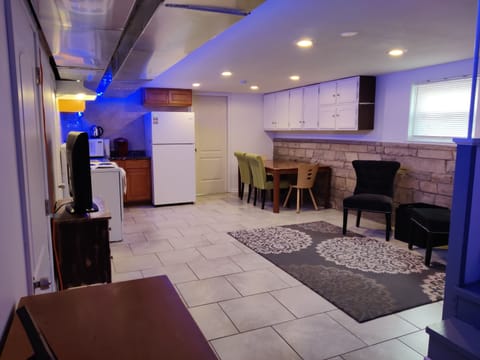 Fresh living room with fun color LED lighting and large SmartTV.