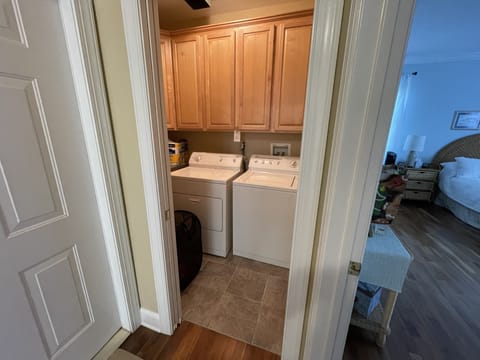 Laundry Room with washer and dryer and ironing board 