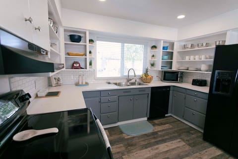 Well lit kitchen, breakfast bar, and coffee/tea bar! 