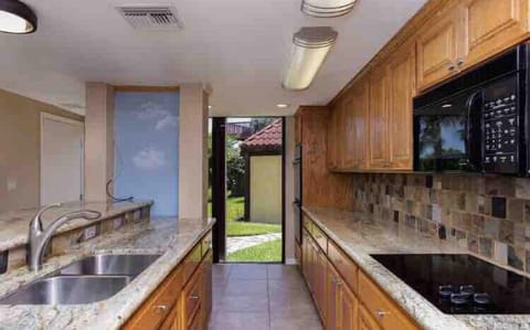Kitchen with lots of natural light and water view.