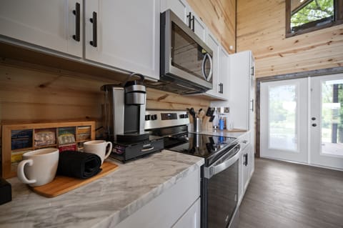 Fully stocked kitchen with a coffee bar that makes slow mornings even better.