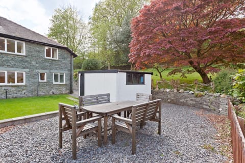 Green Croft in Coniston garden with outdoor furniture