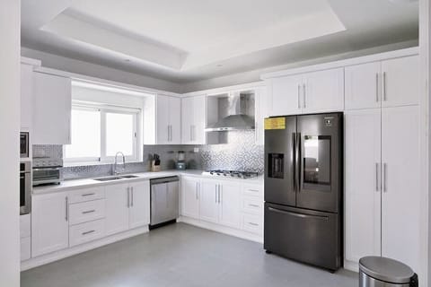 Full Kitchen featuring Samsung Smart fridge with touch screen