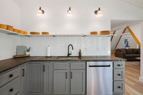 Fully, stocked and updated kitchen featuring marble countertops.