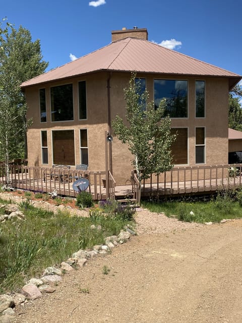 Black Bear Guesthouse. Wonderful large windows & wrap around porch for viewing.
