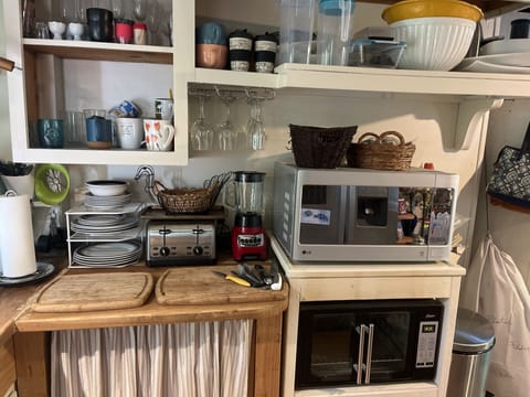 Cottage kitchen with xl convection oven, xl microwave, toaster, mixer etc.