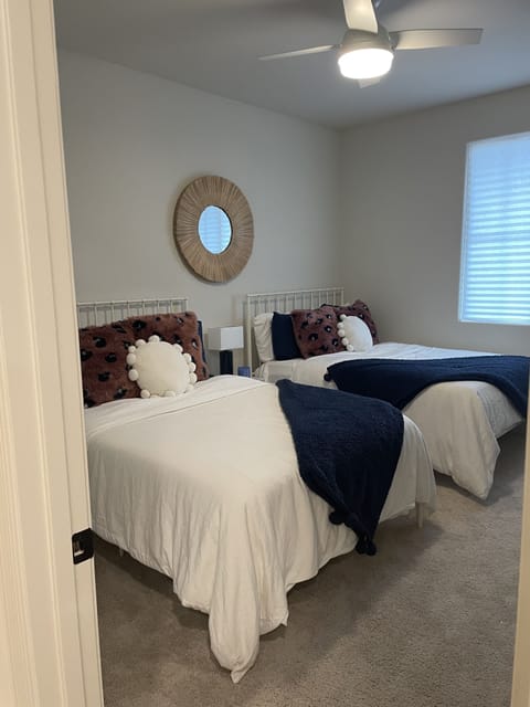 Guest bedroom- 2- twin full beds, fan, walk-in closet, TV