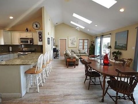 The Great Room with plenty of seating, a granite counter top kitchen.