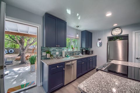 Kitchen and door leading to backyard