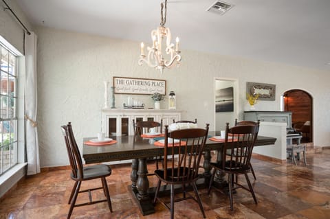 Dining Table that seats 8 or more people! The Hutch Cabinet in the dinning room also houses a number of decorative and practical pieces for guests use. 