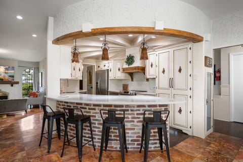 Bar Seating for 4 people in our fully stocked kitchen. Waffle Maker, Rice Cooker, Slow Cooker, plenty of pots and pans, Serving Dishes, grille utensils, and more. 