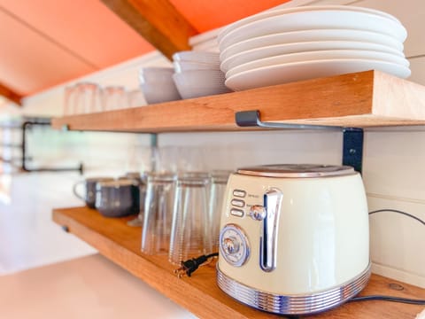 Dishes & toaster in kitchenette