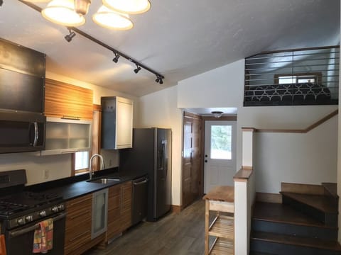Renovated State of the Art Kitchen. Sleeping loft in upper right corner