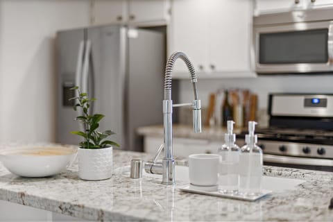 Lovey granite counters and a farm sink