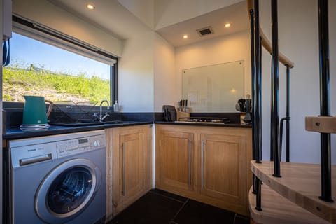 Kitchen area with washing machine
