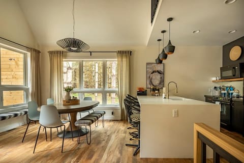 Our generously sized dining table seats up to 10, with additional bar seating