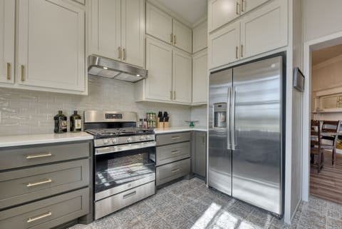 GE 5 burner gas stove and electric oven with GE side-by-side Refrigerator Freezer