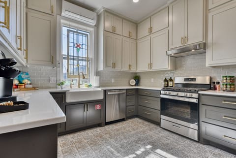 Kitchen with GE SS appliances and farmhouse sink