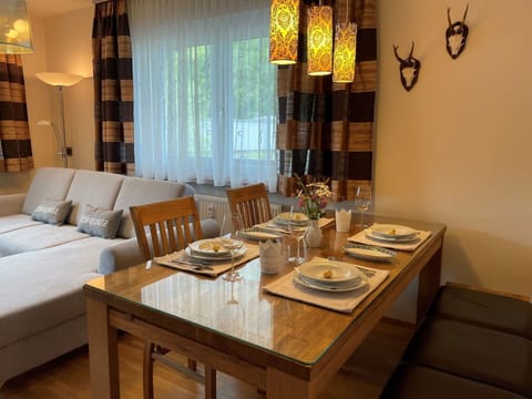 Table, Furniture, Tableware, Building, Wood, Textile, Interior Design, Lighting, Yellow, Architecture