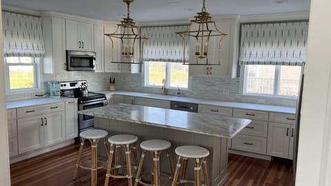 Fully-furnished kitchen with marble and granite countertops