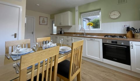The kitchen diner boasts stunning views from the large picture window overlooking the garden and western fells beyond.