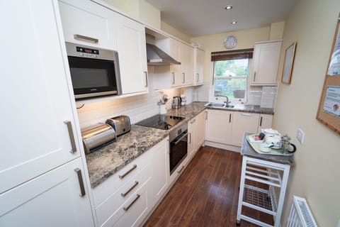 A beautifully maintained kitchen at the rear of the property