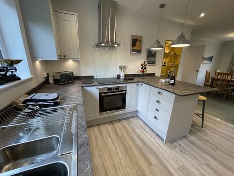 In the modern kitchen you will find induction hob, large fridge freezer and integrated dishwasher