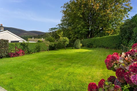 Relax in the delightful spacious garden at the rear of the property
