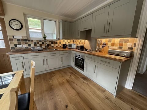 The spacious open plan kitchen and dining room is to the rear of the property