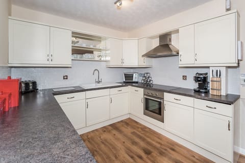 The kitchen is equipped with ceramic hob, oven, fridge, freezer, dishwasher, washing machine and lots of cupboard space