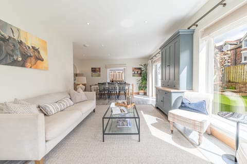 The L-shaped living and dining area is spacious and airy