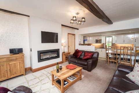 The open plan living area is modern but still retains some of the buildings original character