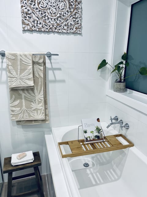 Combined shower/tub, hair dryer, towels, soap