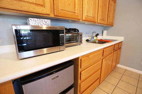 Microwave, coffee/tea maker, toaster, dining tables