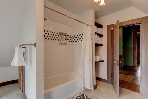 Combined shower/tub, hair dryer, towels, soap