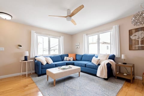 Large living room with comfortable couch and a great breeze
