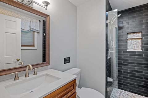 Combined shower/tub, hair dryer, towels, soap