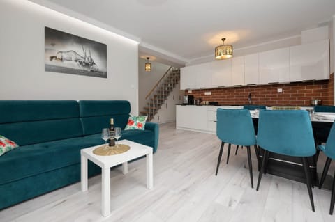 Living room with a comfortable sofa and TV. 