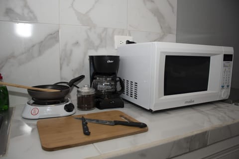 Fridge, microwave, stovetop, coffee/tea maker