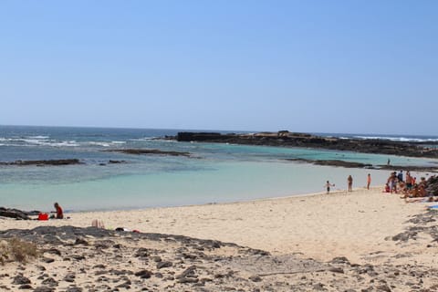 On the beach, beach towels