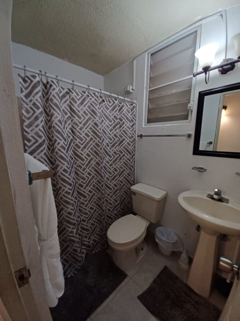 Full bathroom with shower, toilet and sink. Hot water available. 