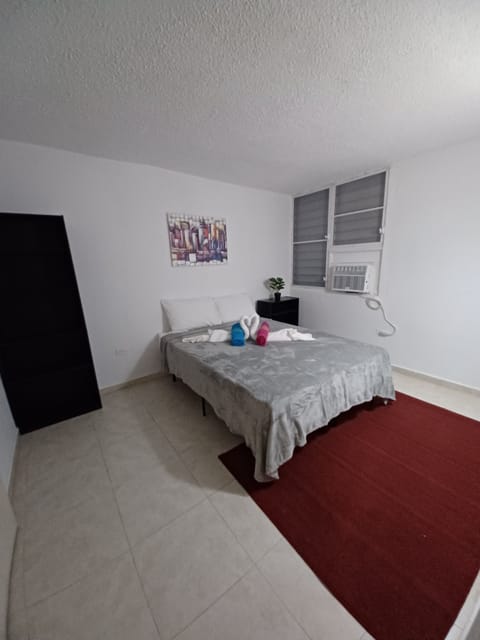 Master bedroom with Queen size bed. Window unit AC.. 