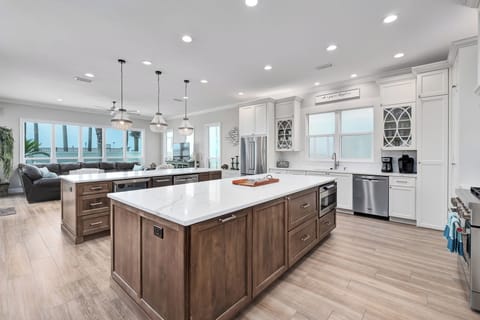 Galley Style Kitchen With Two Serving Islands